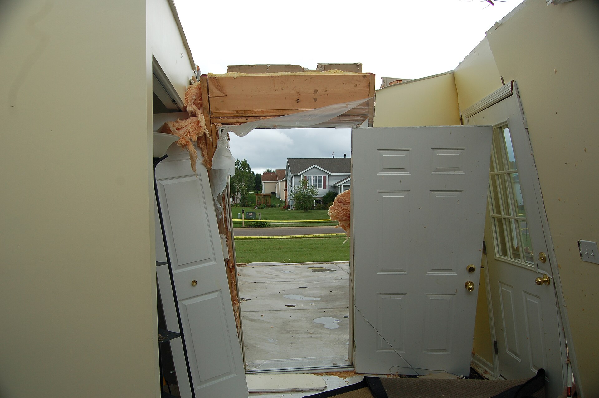 Front opening blown out of a house. Temporary still.